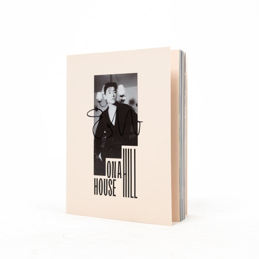 Signed CD case for 'House On a Hill' with a black and white photo of a person on the front cover.