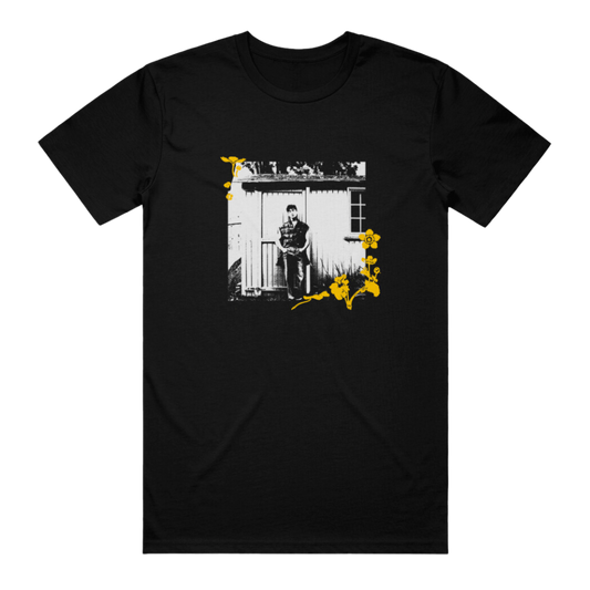 Black t-shirt with a graphic print of a person and yellow accents on the front.